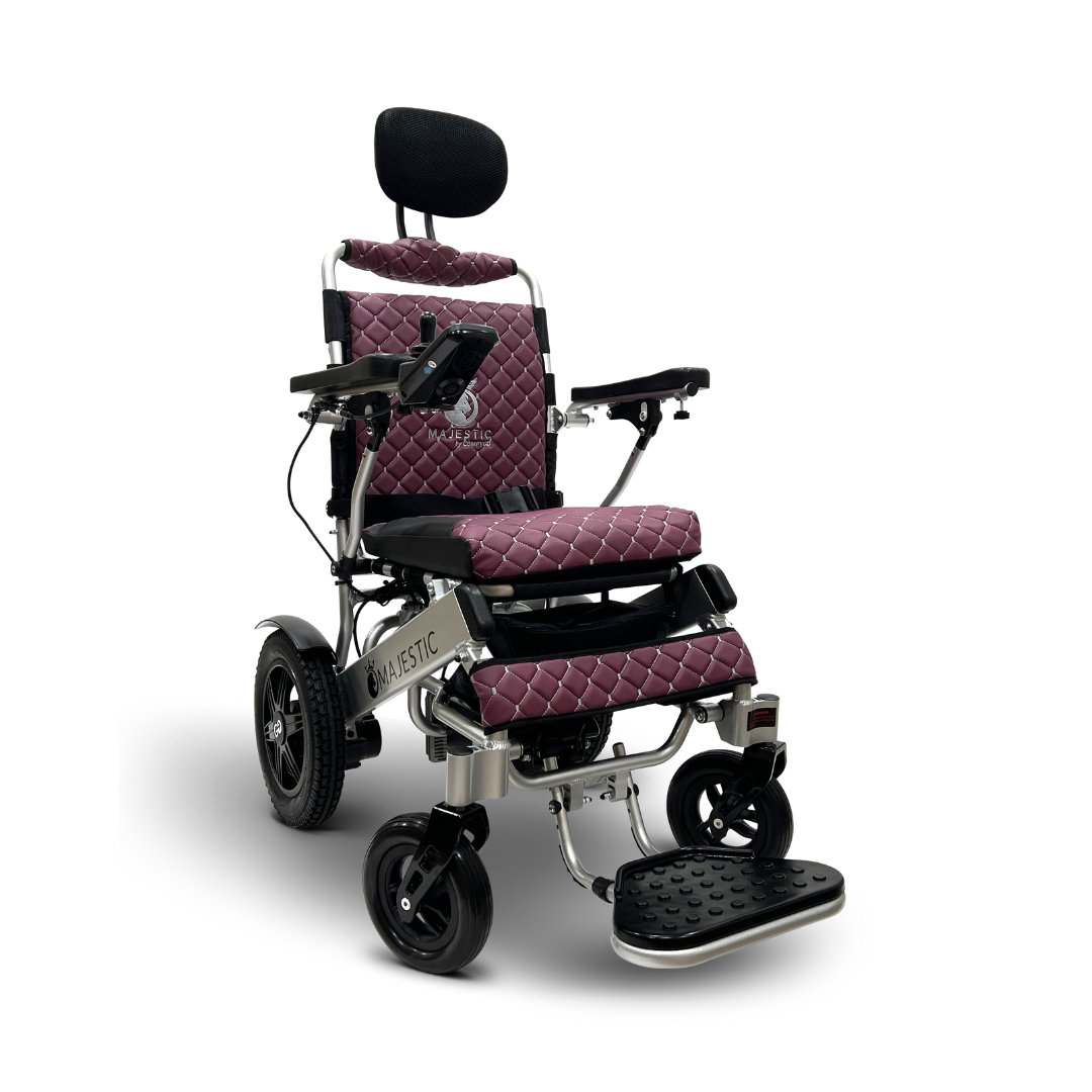 The ComfyGo MAJESTIC IQ-9000 features a quilted purple seat and backrest, black wheels and armrests, a digital joystick controller, and an automatic reclining function. Its sleek design is perfect for indoor and outdoor use.
