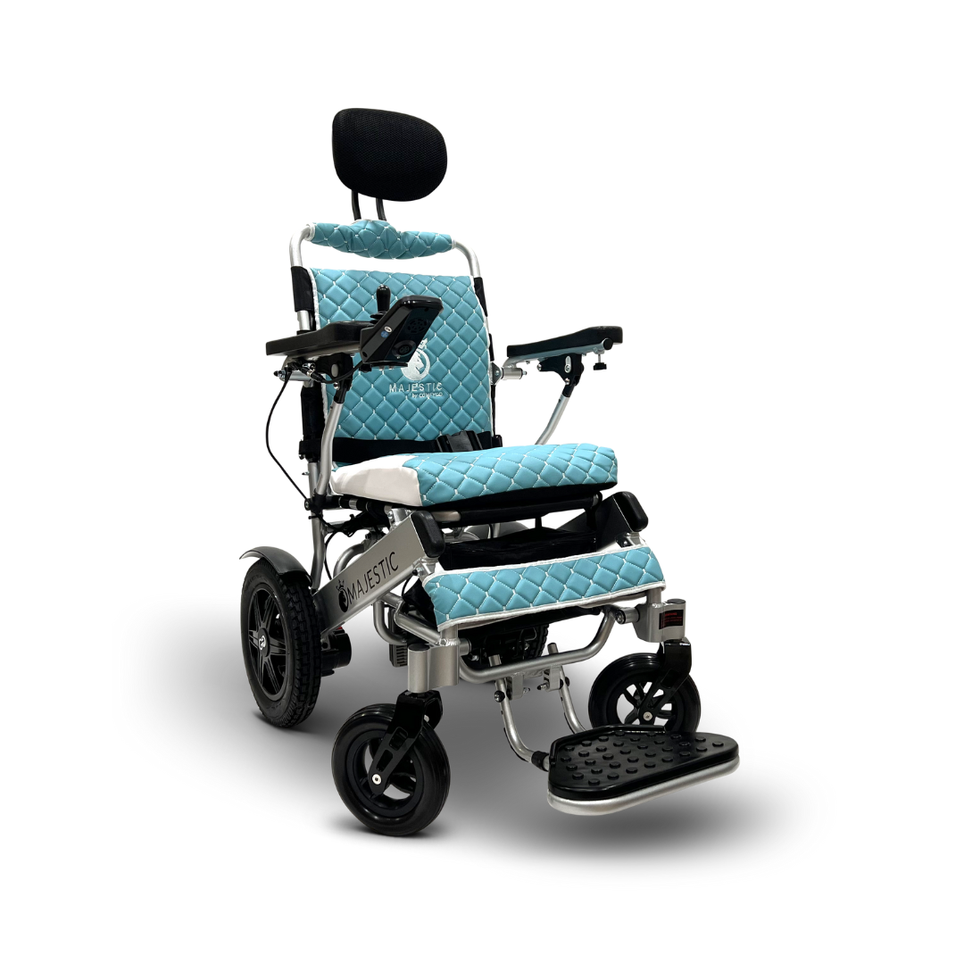 The ComfyGo MAJESTIC IQ-9000 is a sleek electric wheelchair featuring automatic reclining, a black and light blue quilted seat, sturdy black wheels, armrests, headrest, footplate, Majestic branding on the side, and a digital joystick controller for effortless navigation.