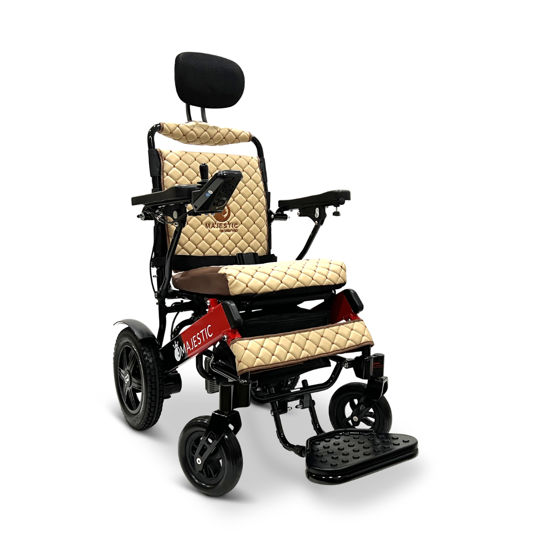 The ComfyGo MAJESTIC IQ-9000 Auto Recline Remote Controlled Electric Wheelchair boasts a quilted beige seat with headrest, complemented by black armrests and striking red accents. Its contemporary design is equipped with a digital joystick controller, a footrest, large rear wheels, and brushless silent motors to ensure smooth operation.