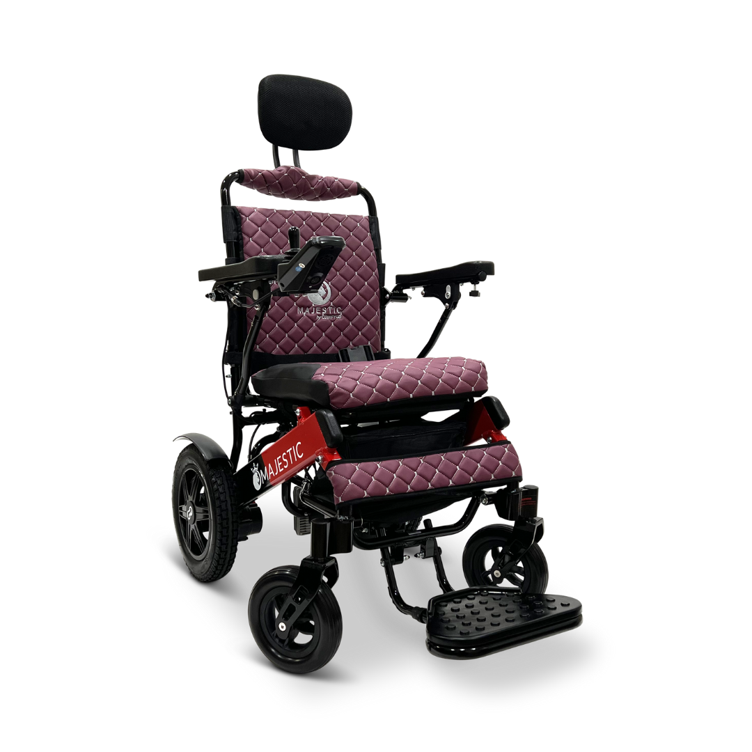 The ComfyGo MAJESTIC IQ-9000 Auto Recline Remote Controlled Electric Wheelchair is a black and red electric model featuring quilted maroon cushioning. It comes equipped with a headrest, armrests, and footrest, enhanced by brushless silent motors and a digital joystick controller. Its sleek design and sturdy wheels make it ideal for various terrains.