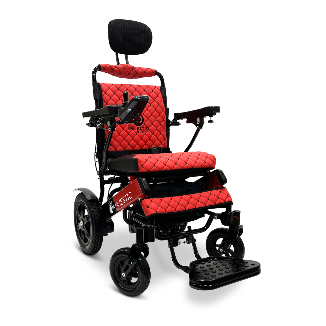 The ComfyGo MAJESTIC IQ-9000 Auto Recline Remote Controlled Electric Wheelchair in red and black features armrests, a footrest, and a headrest with padded, quilted upholstery. It boasts a digital joystick controller and brushless silent motors for a seamless ride.