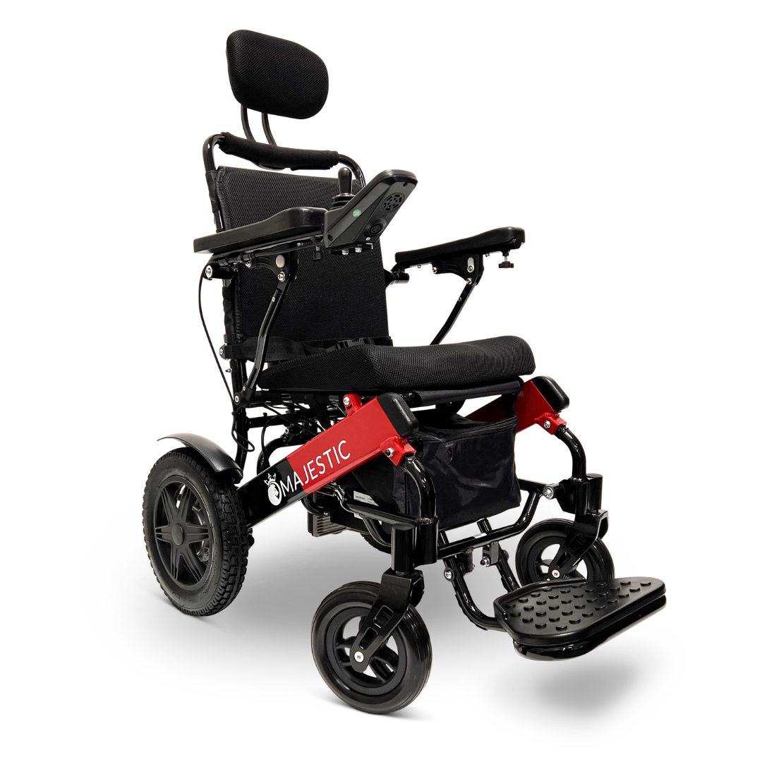 The ComfyGo MAJESTIC IQ-9000 Auto Recline Remote Controlled Electric Wheelchair showcases a sleek black and red design, equipped with brushless silent motors for a smooth ride. It includes a headrest, digital joystick controller, large rear wheels, small front wheels, and a footrest. The brand name is prominently displayed on the frame.