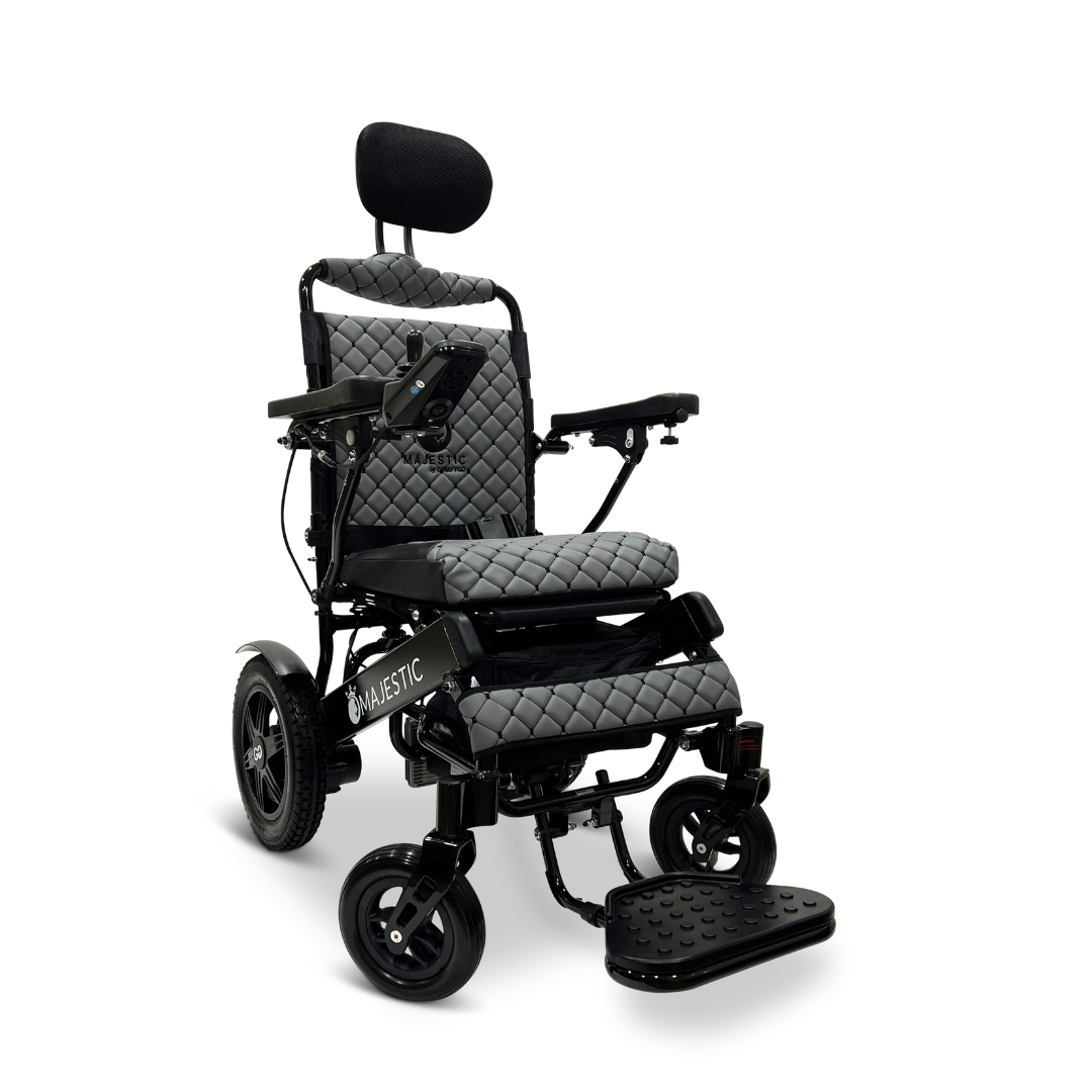 The ComfyGo MAJESTIC IQ-9000 Auto Recline Remote Controlled Electric Wheelchair showcases a black and gray design, featuring a quilted seat, headrest, and armrests. It is equipped with brushless silent motors and includes a digital joystick controller on the right armrest. Its large wheels are ideal for navigating various terrains.