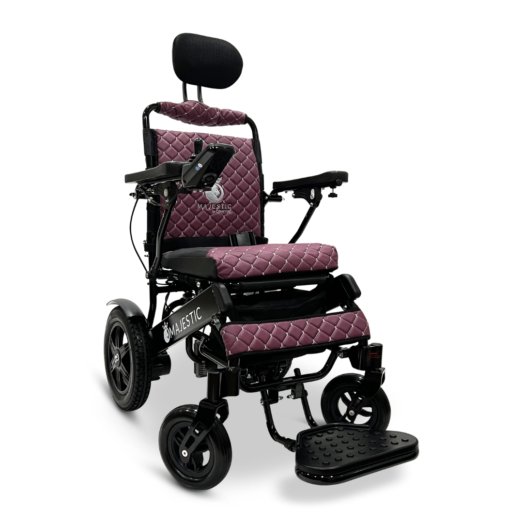 Introducing the ComfyGo MAJESTIC IQ-9000 Auto Recline Remote Controlled Electric Wheelchair, a marvel of modern design. This wheelchair features a luxurious quilted maroon seat and backrest, and is equipped with a digital joystick controller for easy navigation. It includes brushless silent motors and large sturdy wheels, ensuring enhanced mobility and comfort on every journey.