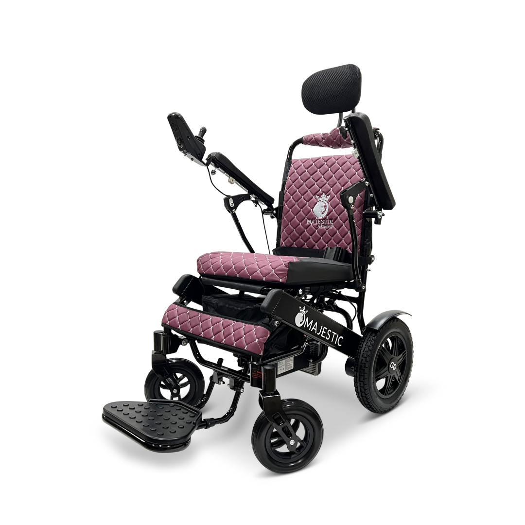 The ComfyGo MAJESTIC IQ-9000 Auto Recline Remote Controlled Electric Wheelchair, a striking combination of purple and black, offers a padded quilted seat, adjustable footrest, and reclining backrest. It features the Majestic logo on the side and is powered by brushless silent motors, while its digital joystick controller ensures exceptional comfort and effortless mobility.
