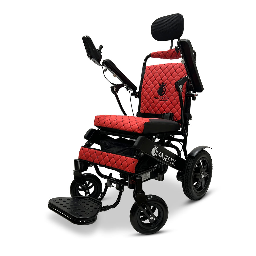 The ComfyGo MAJESTIC IQ-9000 Auto Recline Remote Controlled Electric Wheelchair, in a striking red and black quilted design, features brushless silent motors for a smooth ride. It includes a headrest, armrests, footrest, and a digital joystick controller. The brand name is elegantly displayed on the seat, backrest, and base.
