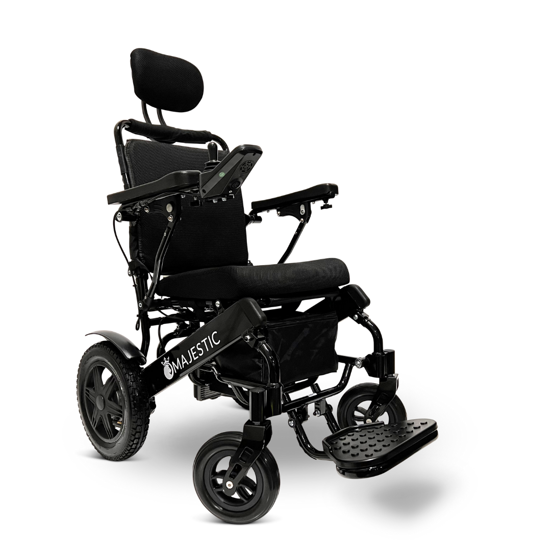 The ComfyGo MAJESTIC IQ-9000 Auto Recline Remote Controlled Electric Wheelchair includes a black cushioned seat, headrest, and armrests. This model is equipped with brushless silent motors and a digital joystick controller conveniently located on the right armrest for smooth mobility. Its robust design is further enhanced by four wheels and a footrest.