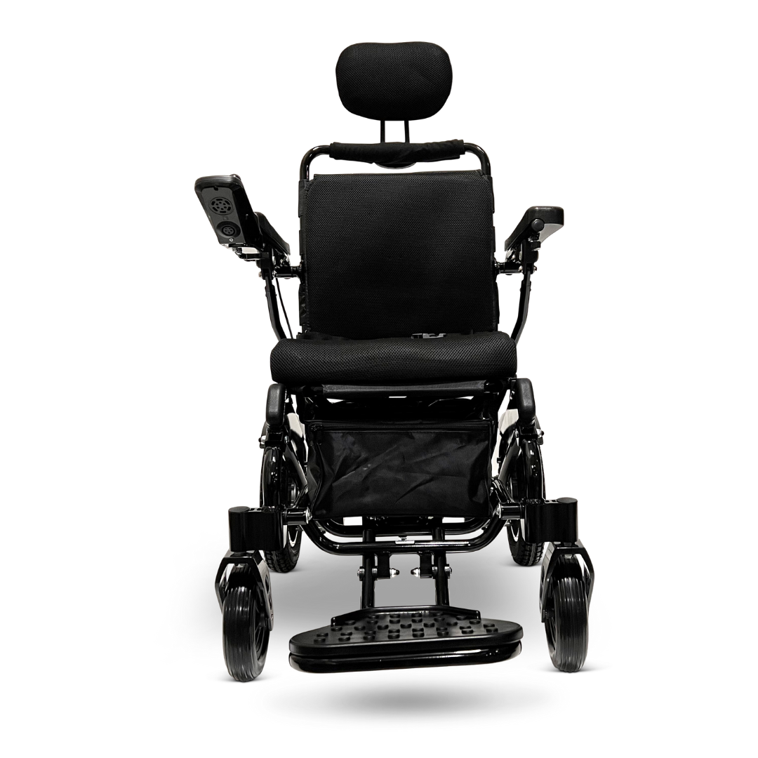 Front view of the ComfyGo MAJESTIC IQ-9000 Auto Recline Remote Controlled Electric Wheelchair, a sleek black motorized marvel featuring brushless silent motors. It offers a cushioned seat, backrest, headrest, and armrests for comfort. The digital joystick controller is conveniently located on the armrest and footplate, showcasing its expert design for mobility assistance.