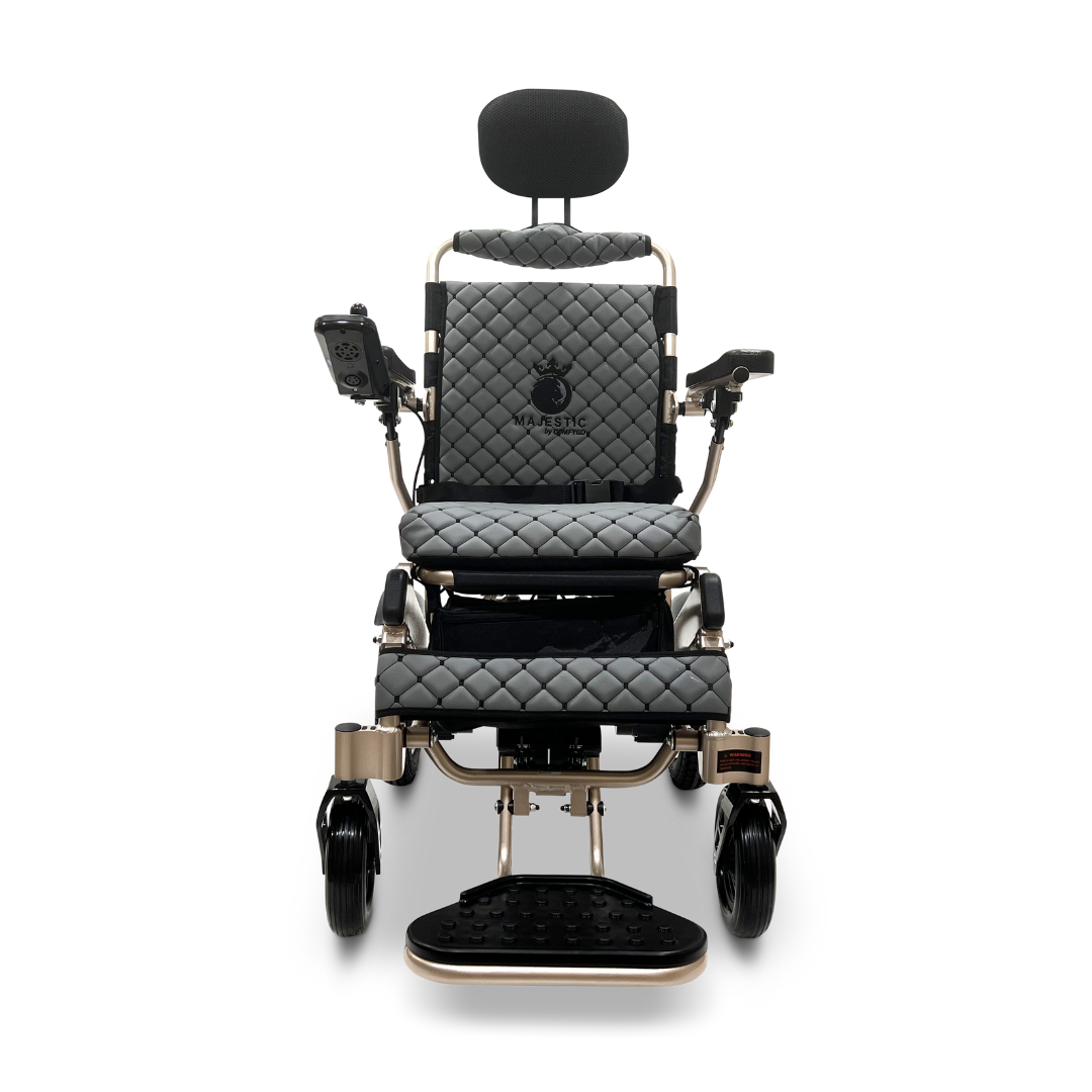 The ComfyGo MAJESTIC IQ-9000 Auto Recline Remote Controlled Electric Wheelchair features a sophisticated black quilted seat and backrest, along with a headrest, armrests, and footrest. It includes a digital joystick controller positioned on the right armrest and is equipped with brushless silent motors for a compact and stylish design.
