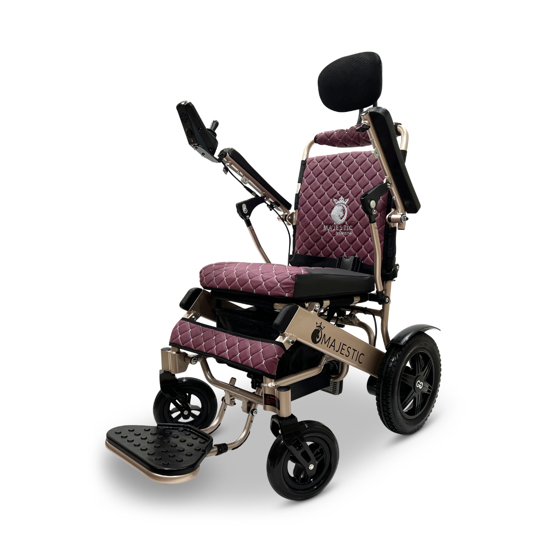 The ComfyGo MAJESTIC IQ-9000 Auto Recline Remote Controlled Electric Wheelchair, available in maroon and black, features a digital joystick controller. It includes a quilted seat with padded armrests, an adjustable headrest and footrest, along with sturdy black wheels. Its brushless silent motors guarantee a smooth and quiet ride.
