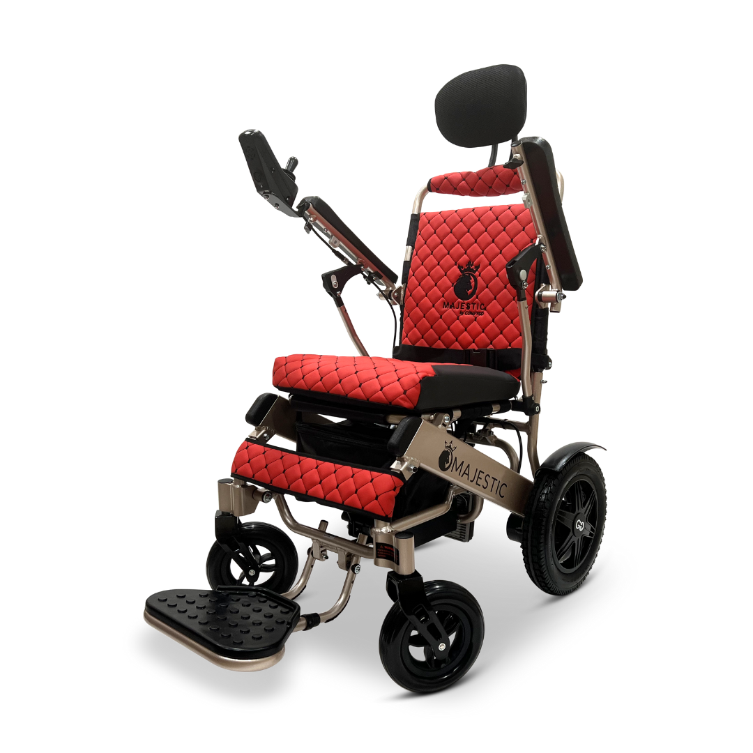 The ComfyGo MAJESTIC IQ-9000 Auto Recline Remote Controlled Electric Wheelchair in striking red and black features a padded seat and backrest, armrests, headrest, and large rear wheels. It is enhanced with brushless silent motors and a digital joystick controller, showcasing the Majestic brand on its frame to ensure both comfort and cutting-edge performance.