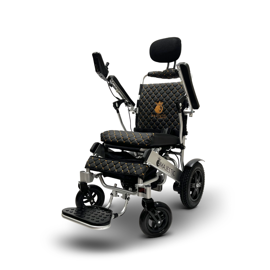 The ComfyGo MAJESTIC IQ-9000 features padded black and gold quilted upholstery, adjustable armrests, head support, a footrest, digital joystick controller, and a control panel. Its sleek design and automatic reclining provide unmatched comfort.
