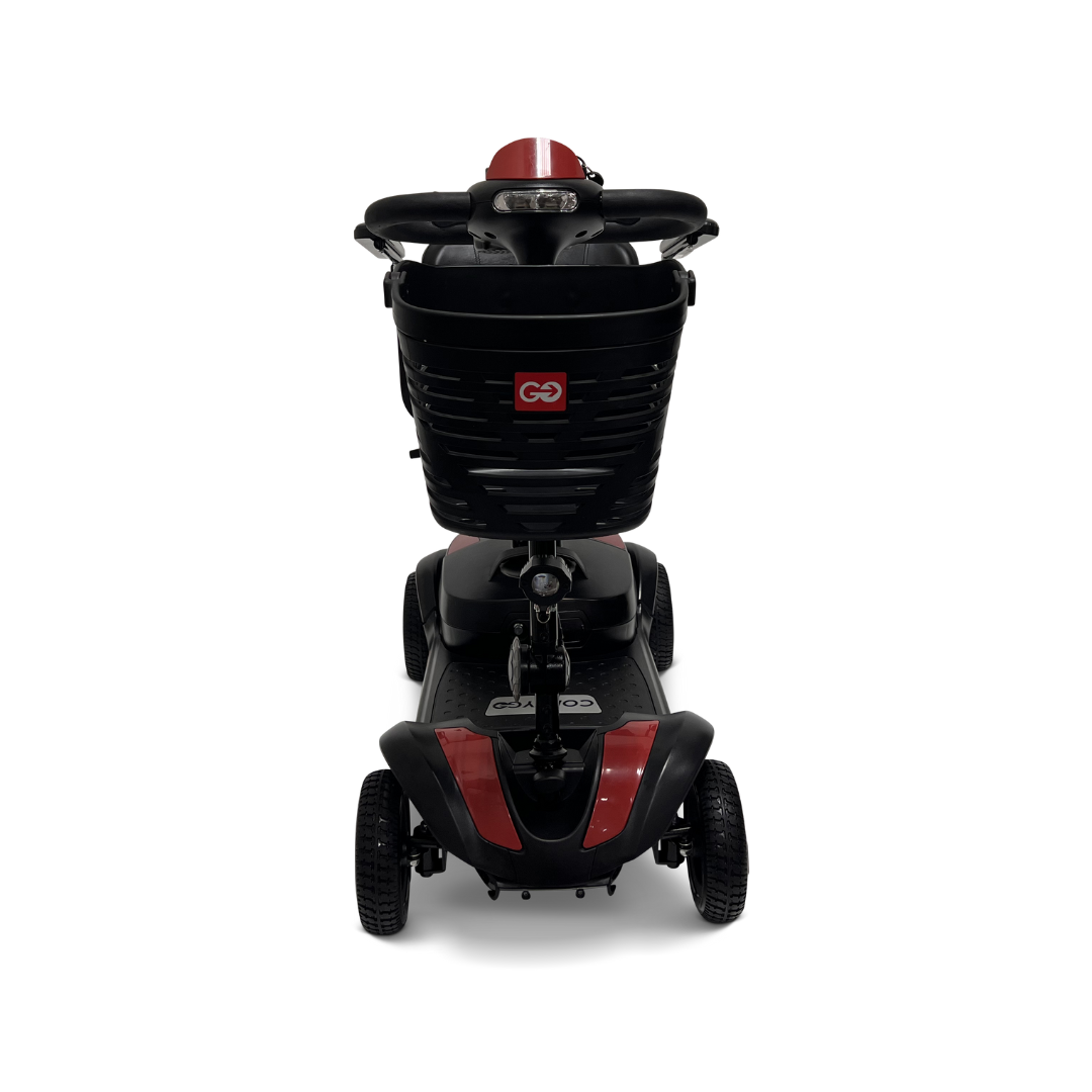 Introducing the ComfyGo Z-4 Ultra-Light Electric Mobility Scooter, a red and black portable solution. Front view shows its sturdy base with four wheels for all-terrain use, a comfortable backrest, and a practical basket on the handlebars.
