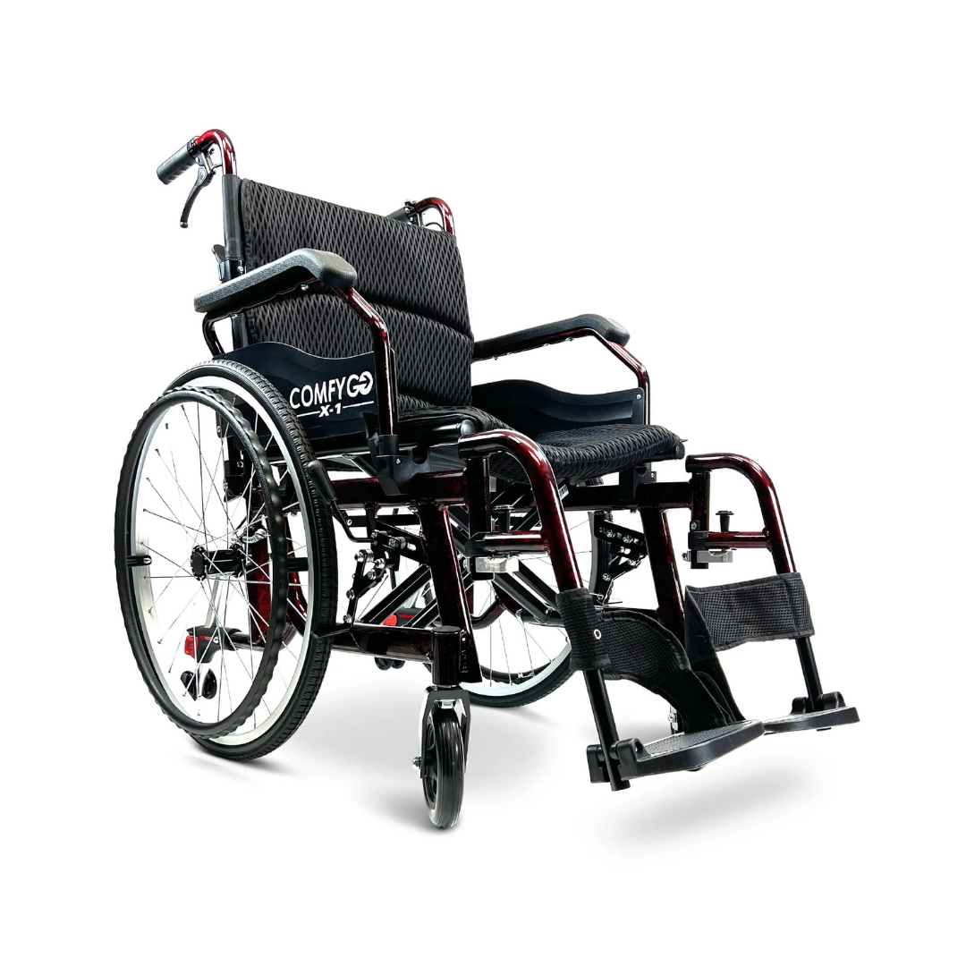 A ComfyGo X-1 Lightweight Manual Wheelchair - Open Box Slightly Used in black and red, featuring large quick-detach rear wheels, footrests, padded seat and backrest is displayed on a white background.
