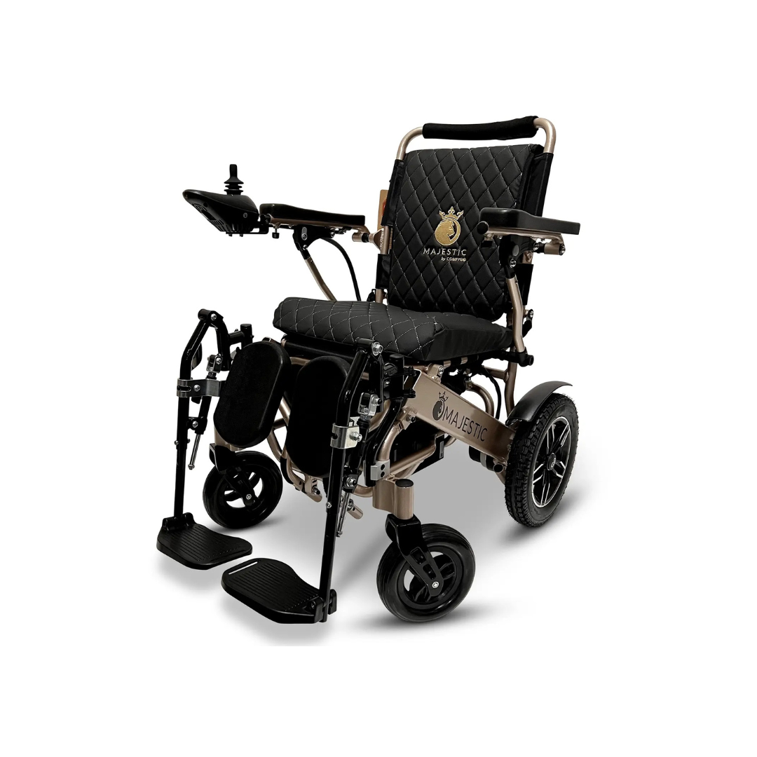 ComfyGo Elevating Legrest Set, compatible with IQ-8000 and IQ-9000 wheelchairs, features black quilted seat and backrest, gold frame, large rear wheels, joystick armrest control, and Majestic IQ-8000 logo on backrest and side panel.