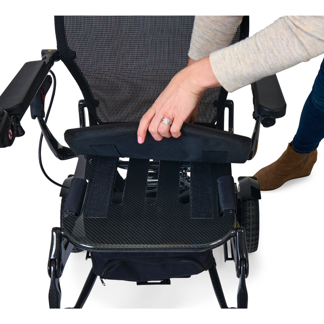 The seat cushion lifts very easily on the Golden Tech Carbon Fiber Cricket Power Wheelchair