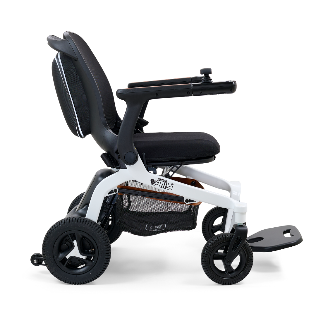 Enjoy the ease of the Golden Tech Ally Folding Power Wheelchair, available in black and white. Ideal for travel, it boasts four wheels, a cushioned seat with armrests, under-seat mesh storage, and a footrest. Enhance your ride with Smart Control Mobile App connectivity.