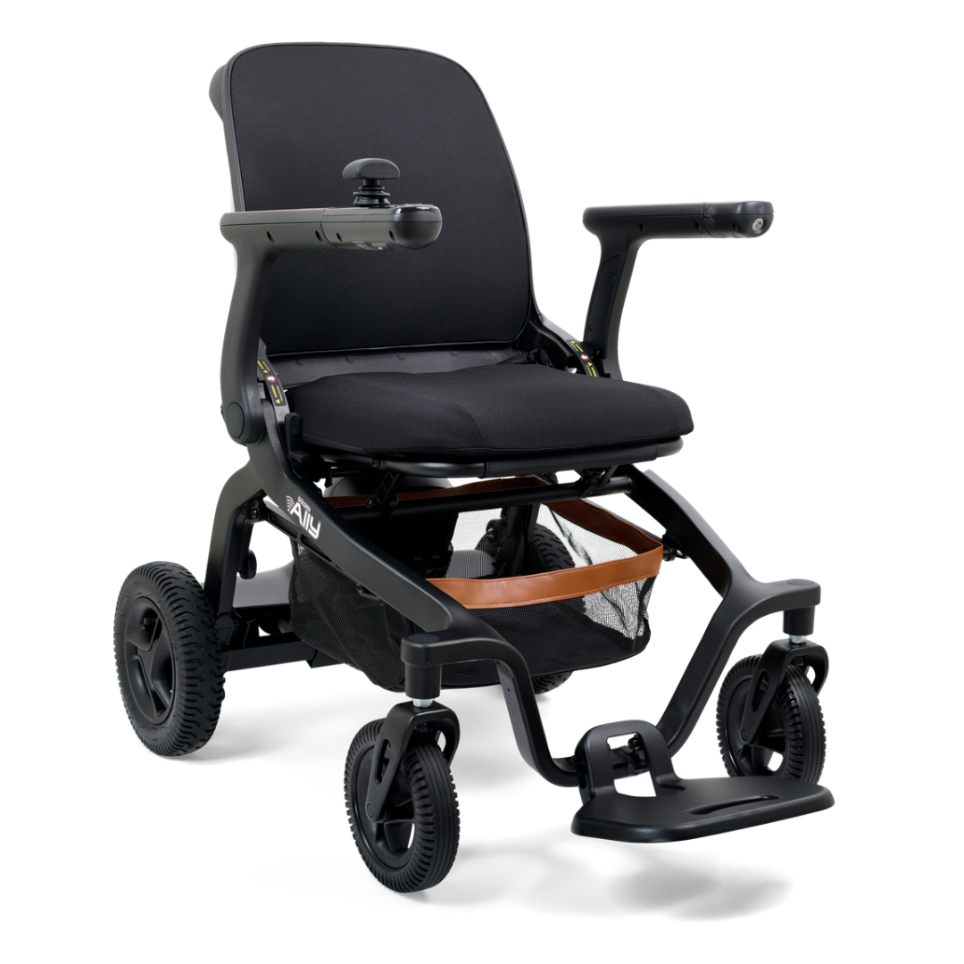 The Golden Tech Ally Folding Power Wheelchair is sleek, lightweight, and ideal for travel with its black frame, cushioned seat, joystick armrest control, and Smart Control Mobile App integration. Four small wheels enhance indoor maneuverability.
