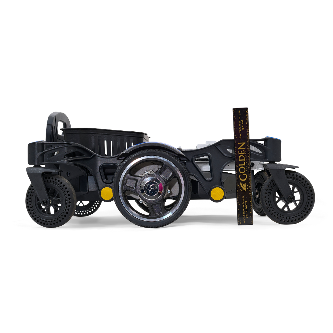 A sleek profile shot of the Golden Tech GP130 Buzzaround CarryOn Portable Powerchair in black is set against a white background. With its ultra-compact, three-wheel design and a ruler for scale, it features smaller front wheels, making it perfect for any adventure.