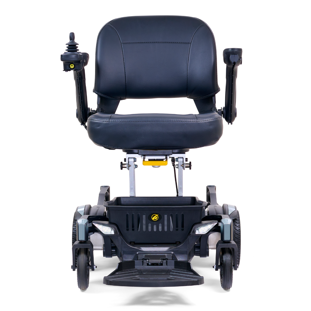The stylish Golden Tech GP130 Buzzaround CarryOn is a black motorized wheelchair featuring a padded seat, armrests, joystick control on the right, ultra-compact four-wheel suspension, and modern design. It is depicted folded from the front against a white background.