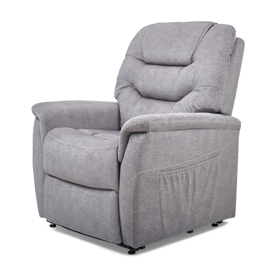 The Golden Tech PR446 DeLuna™ Dione Recliner with Lift Assist - Medium is a plush gray chair featuring a high backrest, padded armrests, textured fabric, and MaxiComfort Positioning for ultimate relaxation. It includes a side storage pocket and showcases its design in the left-side profile.