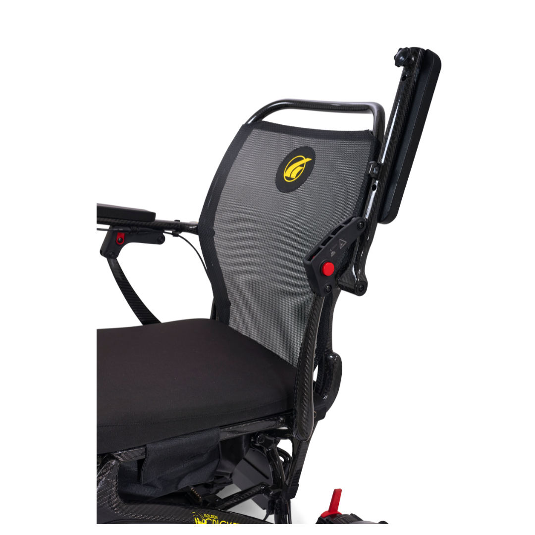 A close-up of the Golden Tech Carbon Fiber Cricket Power Wheelchair, weighing only 33 lbs, with a black mesh backrest, padded seat, yellow logo, foldable armrest, and a sleek carbon fiber minimalist design.
