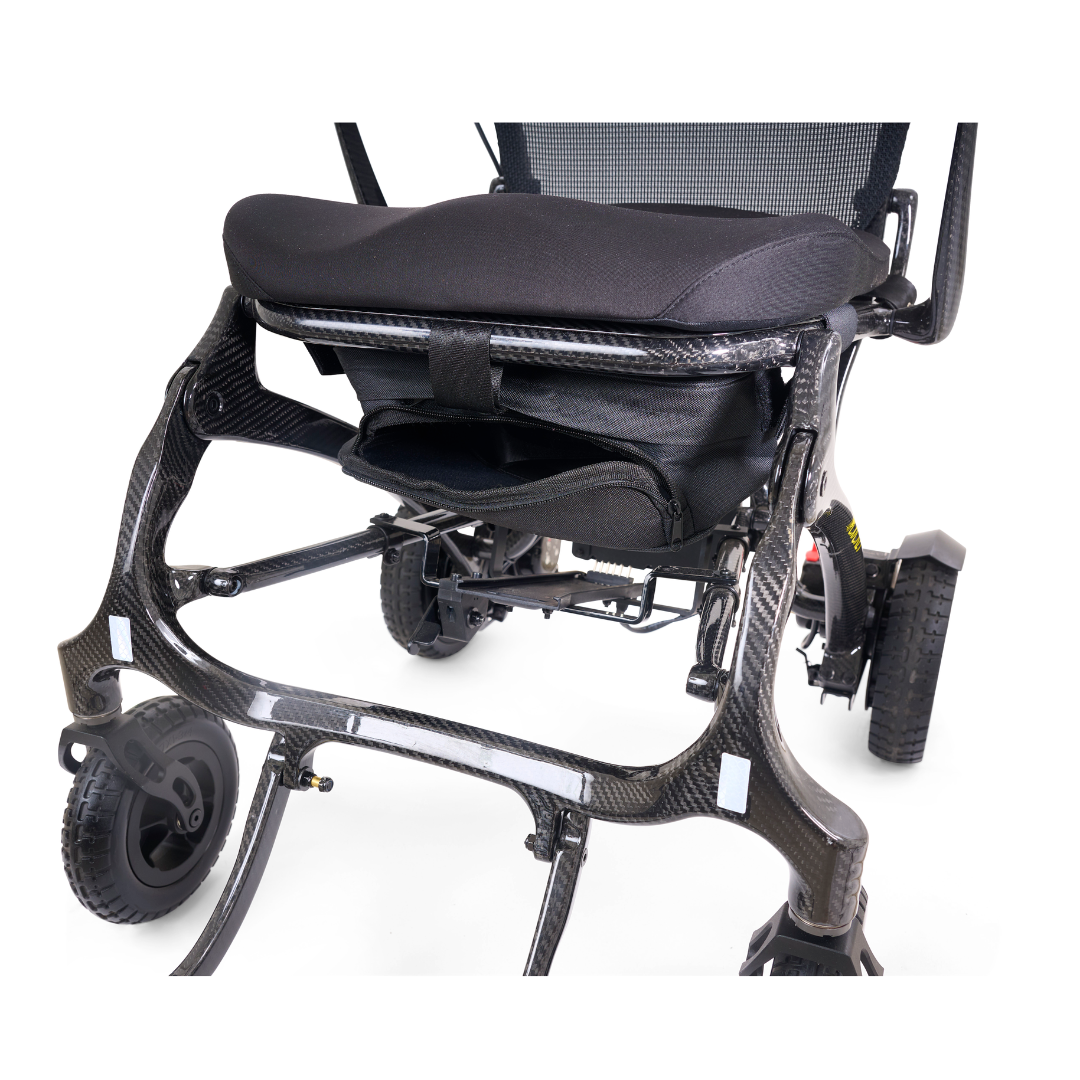 Close-up view of the Golden Tech Carbon Fiber Cricket Power Wheelchair, weighing only 33 lbs, with a cushioned seat, mesh backrest, and large rear wheels, highlighting its sturdy and modern black carbon fiber design.
