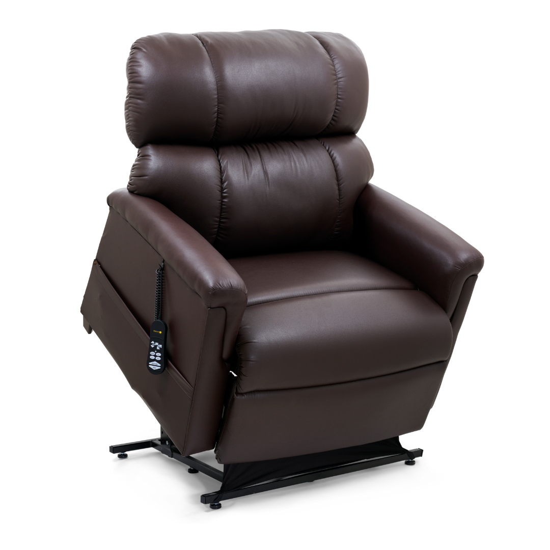 The Golden Tech PR535 MaxiComfort Recliner w/ Lift Assist is a brown leather chair with ergonomic support, padded arms and backrest, MaxiComfort positioning, side remote, and a partially elevated footrest.
