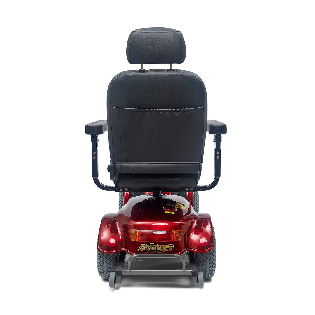 The rear view of the red Golden Tech Avenger HD Bariatric Mobility Scooter highlights its black cushioned seat with armrests and large tires, ideal for rugged terrain. This heavy-duty scooter offers a long operating range, ensuring reliability on any adventure.