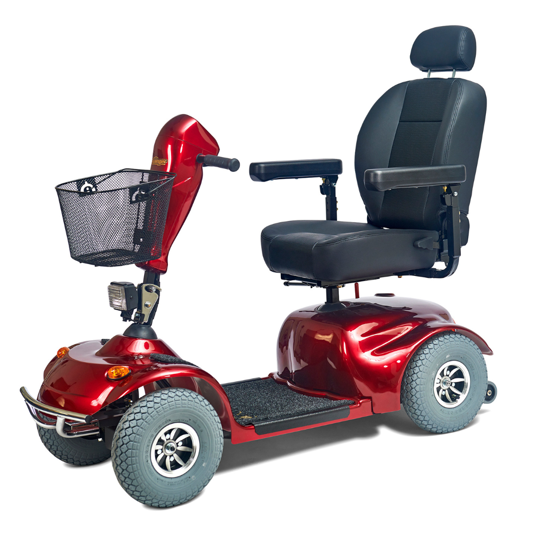 The Golden Tech Avenger HD Bariatric Mobility Scooter is a red, four-wheel scooter designed for rugged terrain. It features a black seat with armrests, headrest, front basket, and handlebars for steering, making it ideal for long-distance personal transportation.