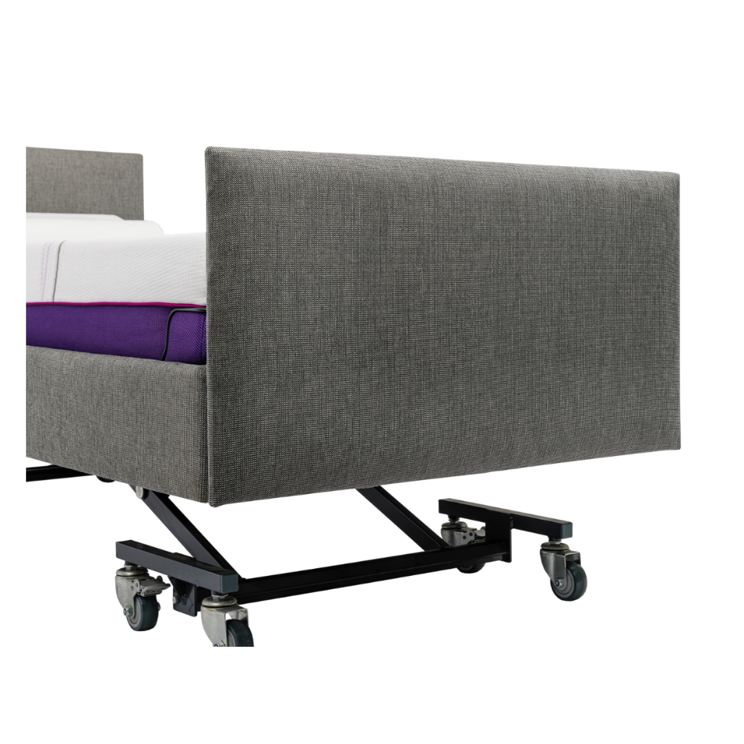 A close-up of the iCare Medical IC100 Static Partner Non-Adjustable Bed featuring a metal frame, wheels, and an antibacterial vinyl purple mattress, shown against a white background.