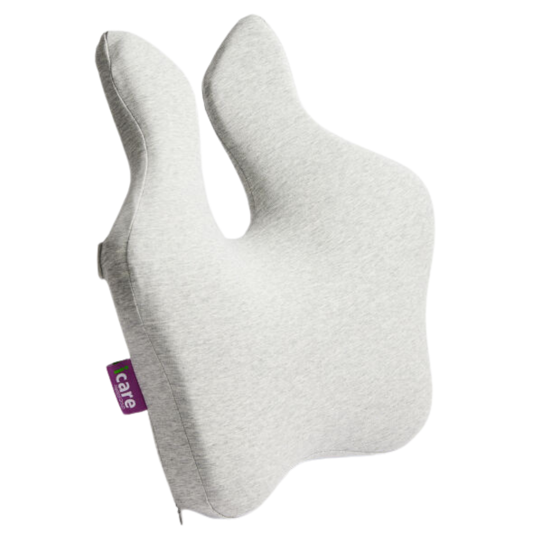 The iCare Reform Full Back Support is a light gray, ergonomically shaped pillow with two upward extensions, made from Charcoal-infused ActiveX foam for ergonomic relief. It features a small purple side tag labeled care.