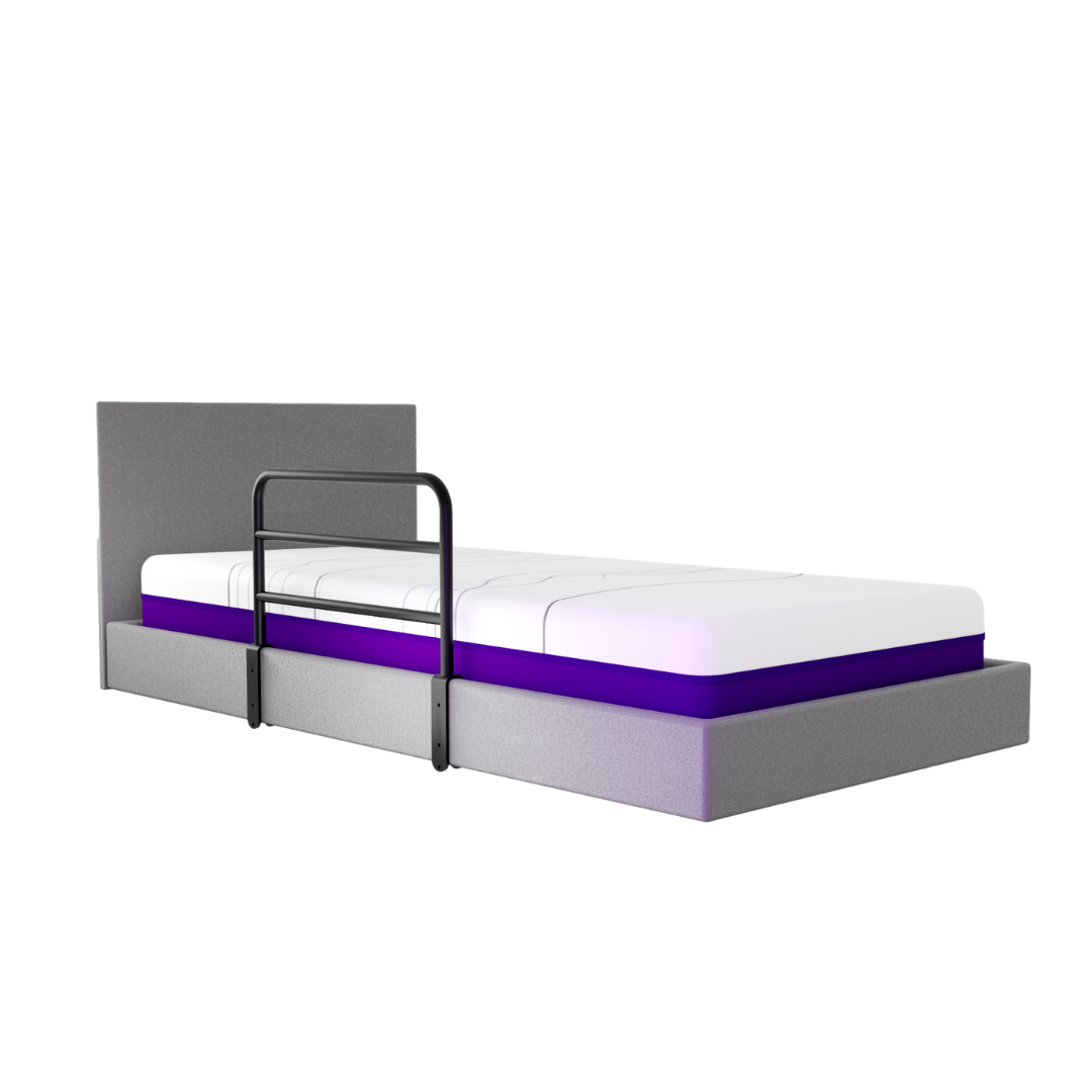 A gray bed with a tall headboard and white mattress features the iCare Medical Bed Safety Rails attached to one side for bedside support, shown against a white background.