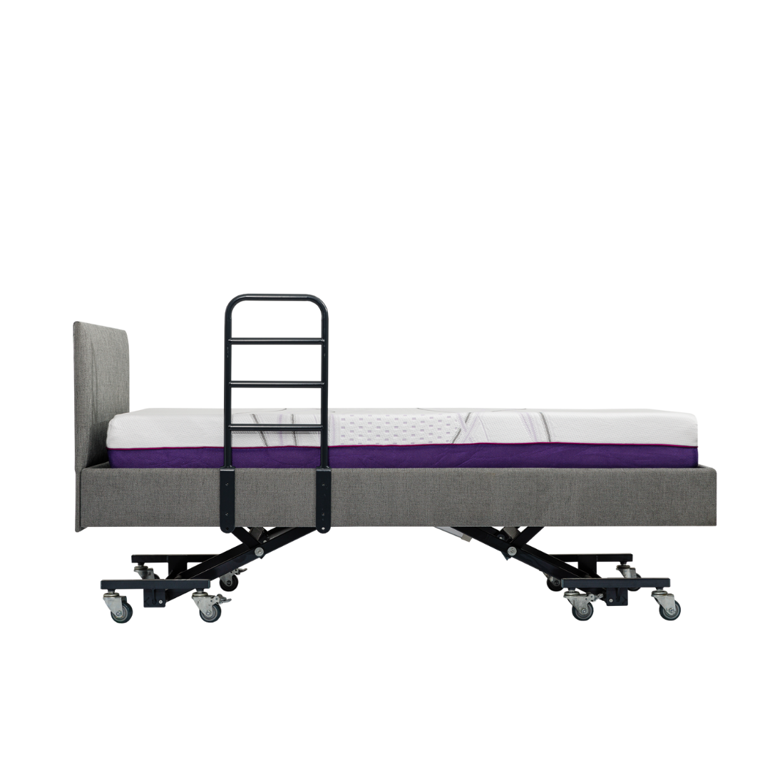 A side view of an adjustable hospital-style bed with a grey upholstered frame, mattress, iCare Medical Bed Safety Rails for support and fall prevention, plus wheels on the legs, isolated on a white background.