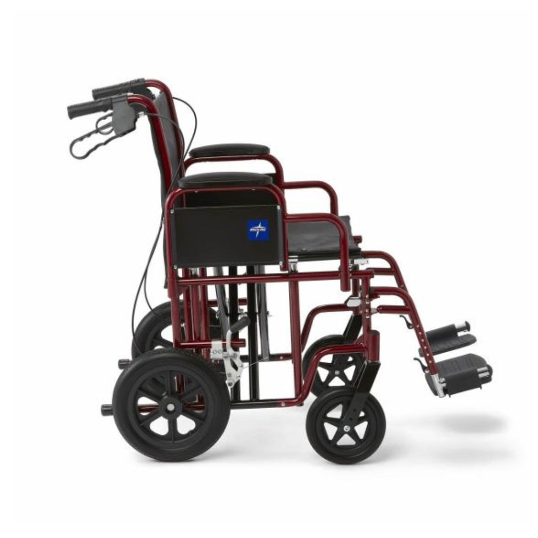 The Medline Bariatric Transport Chair features a red aluminum frame with black seating, shown in a side profile. It includes large rear wheels, smaller front wheels, swing-away footrests for comfort, and back handles for effortless pushing.