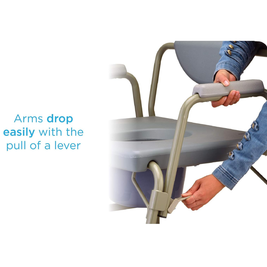 A person demonstrates the Nova Bariatric Bedside Commodes Drop-Arm mechanism on a gray chair with a light gray padded seat, showing how the arms drop easily with a lever pull. The focus is on the armrest and lever, highlighting its versatile functionality.
