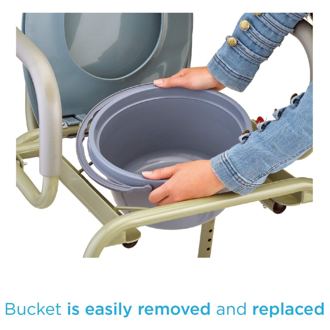 A person in a denim jacket removes a gray bucket from a Nova Drop Arm 3-In-1 Commode. The chair, with metal arms, promotes easy tool-free bucket removal and replacement, offering versatile standalone or over toilet use.