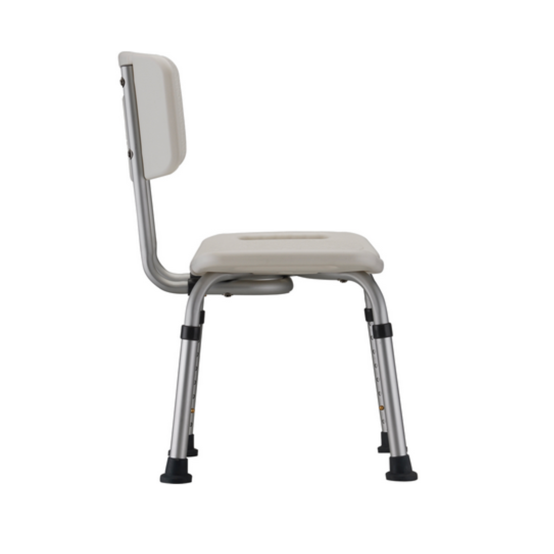 Side view of the Nova Medical Bath Seat featuring a beige, U-shaped seat and backrest, supported by metal legs with black rubber feet. Its utilitarian design suits various settings, offering adjustable height for personalized comfort.