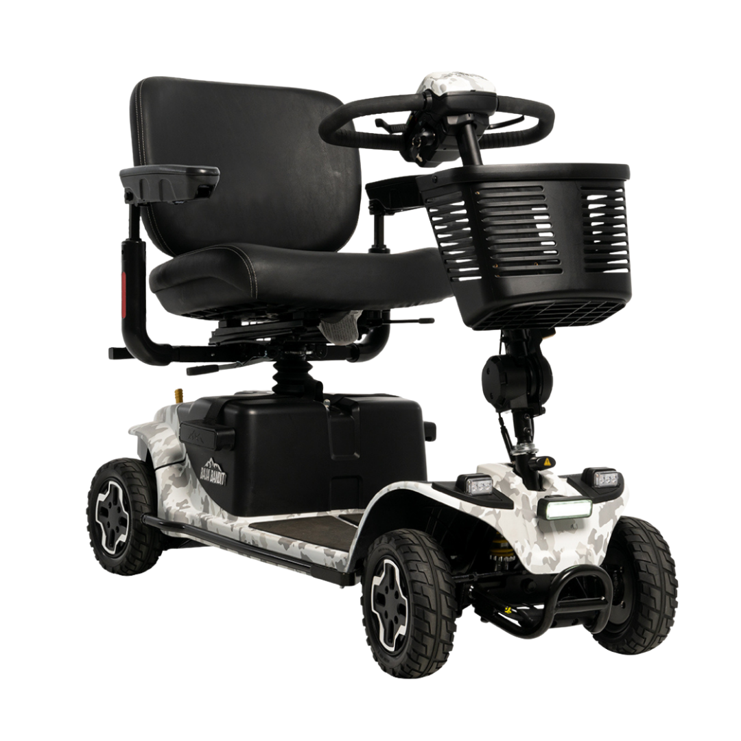The Pride Baja® Bandit 4 Wheel Scooter features a compact design with a black seat, armrests, front basket, sturdy wheels, and a white camouflage-patterned frame—ideal as an off-road mobility scooter for outdoor adventures.