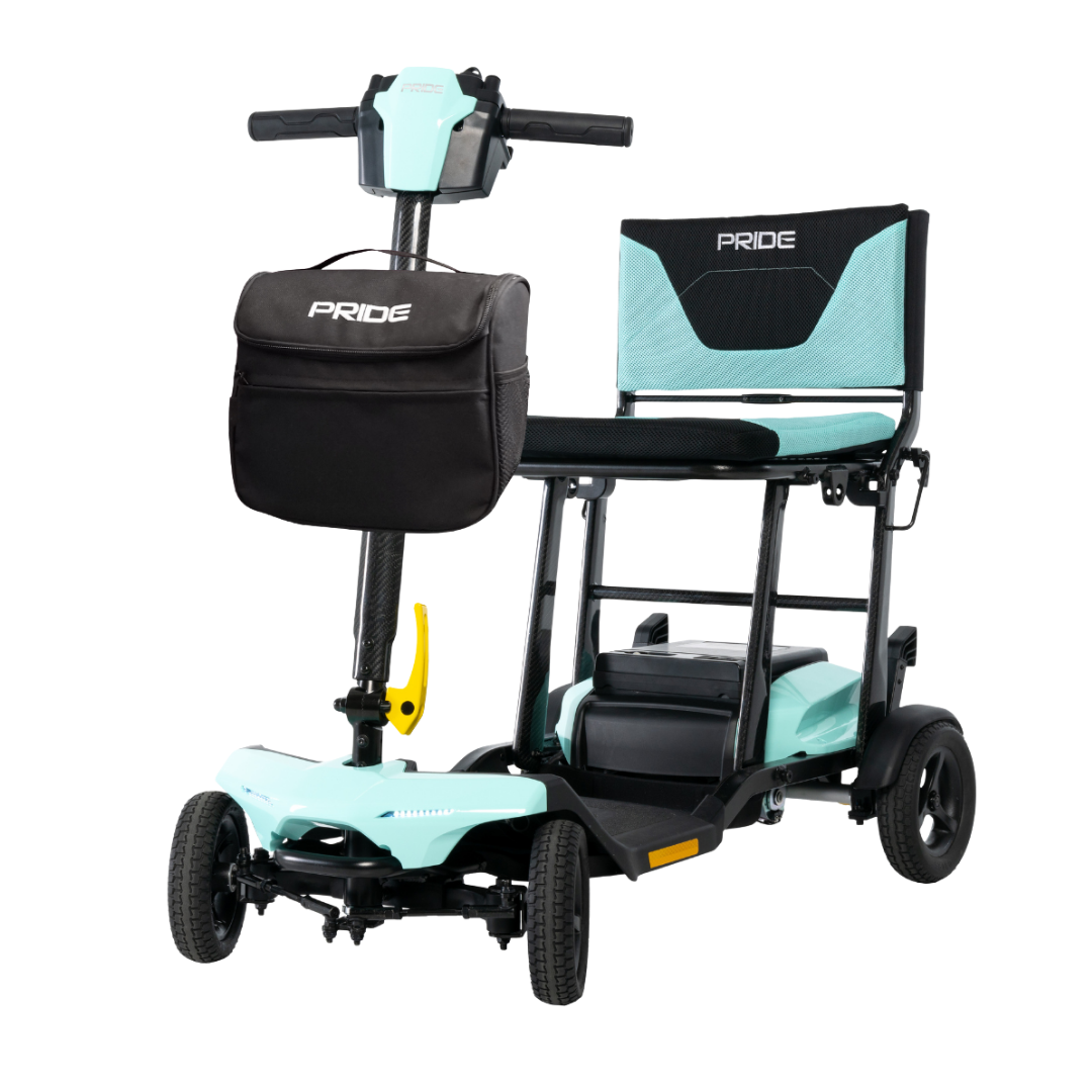 The Pride Mobility Go Go® Super Portable Mobility Scooter features a compact, lightweight black and mint green frame, four wheels, a padded seat with backrest, and a black PRIDE-labeled front storage bag—ideal for easy travel.