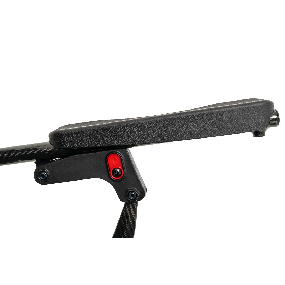 Close-up of a black padded armrest on the Pride Mobility Jazzy® Carbon Ultralite Powerchair with visible bolts and a red accent, highlighting its sleek, modern design. It perfectly balances style and efficiency in this ultra-lightweight travel powerchair.