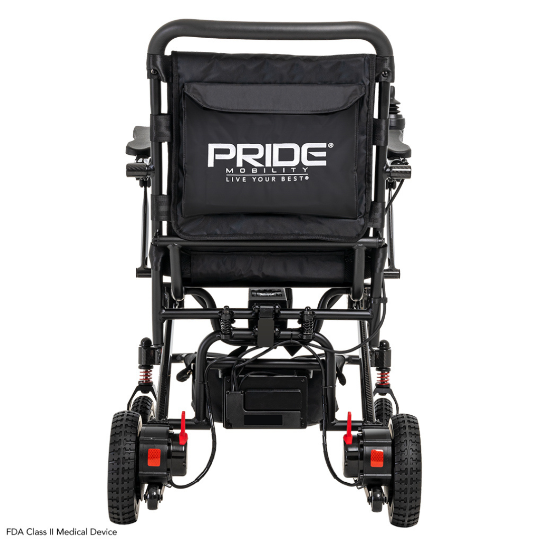 A rear view of the black Pride Mobility Jazzy® Carbon Ultralite Powerchair shows PRIDE on the backrest. It features red suspension springs, rugged wheels for comfort, and a removable joystick with USB charging for convenience.