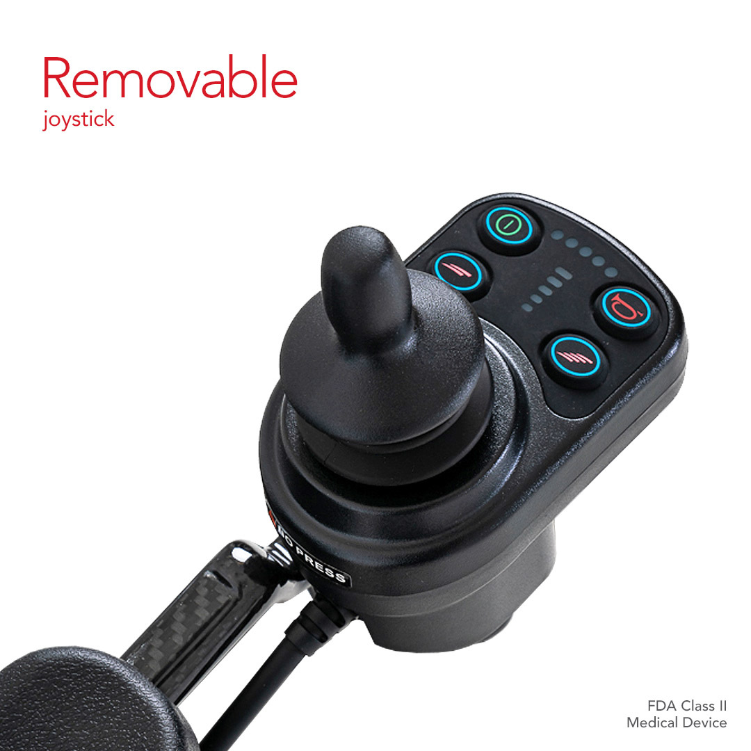 Close-up of a removable joystick with an ergonomic design perfectly suited for the Pride Mobility Jazzy® Carbon Ultralite Powerchair. It has a black handle, colorful side buttons, and displays Removable joystick and FDA Class II Medical Device, emphasizing its lightweight advantage.