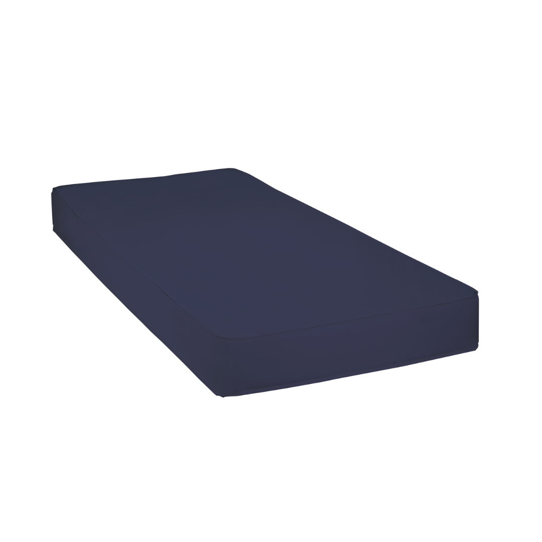 A ProBasics Fiber Core Mattress with Polypropylene Cover in twin size, featuring an economical design, is shown with a plain dark blue fitted sheet against a white background.
