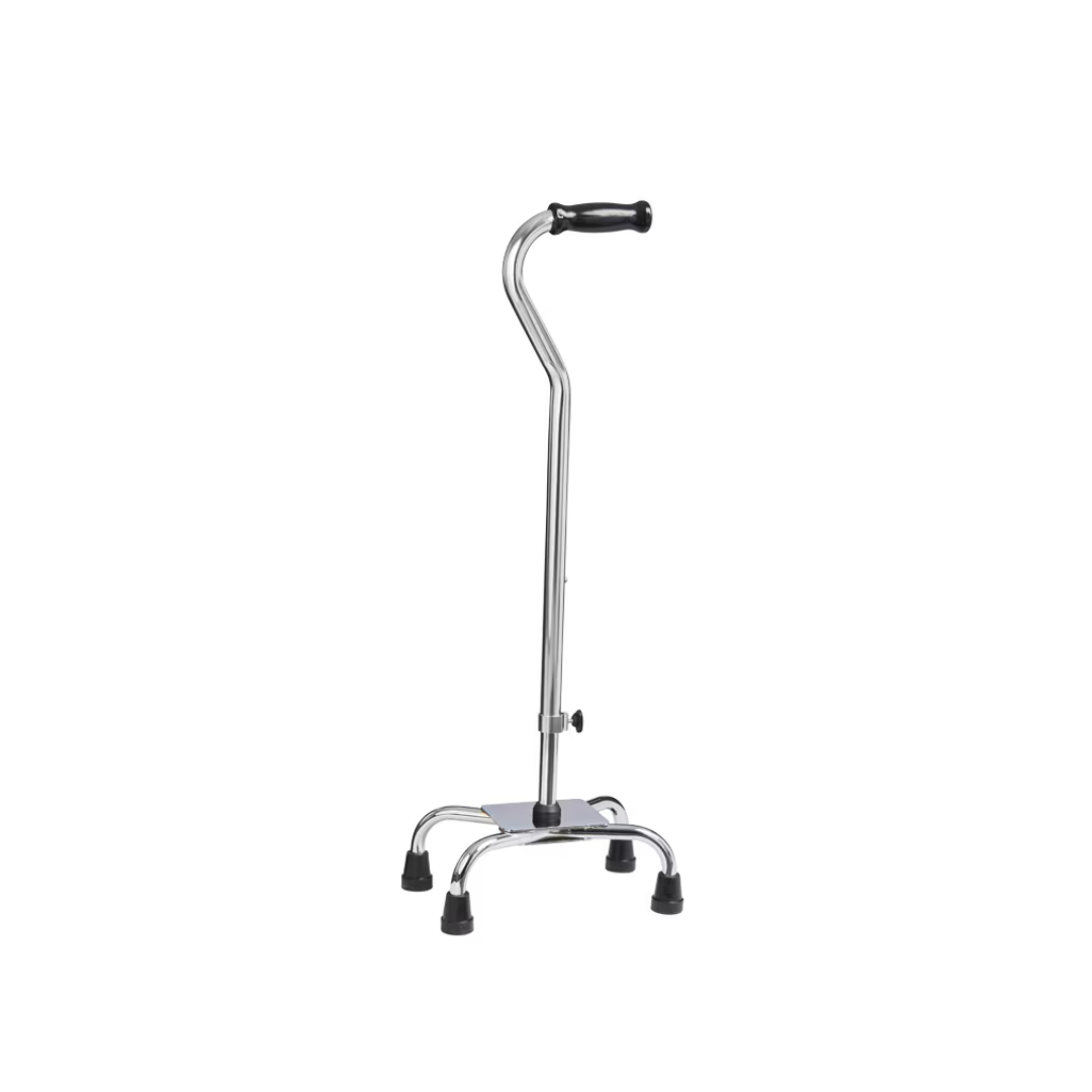 A quad cane with a chrome-colored shaft and a black handle. The base has four rubber-tipped legs for stability, designed to aid mobility and support.