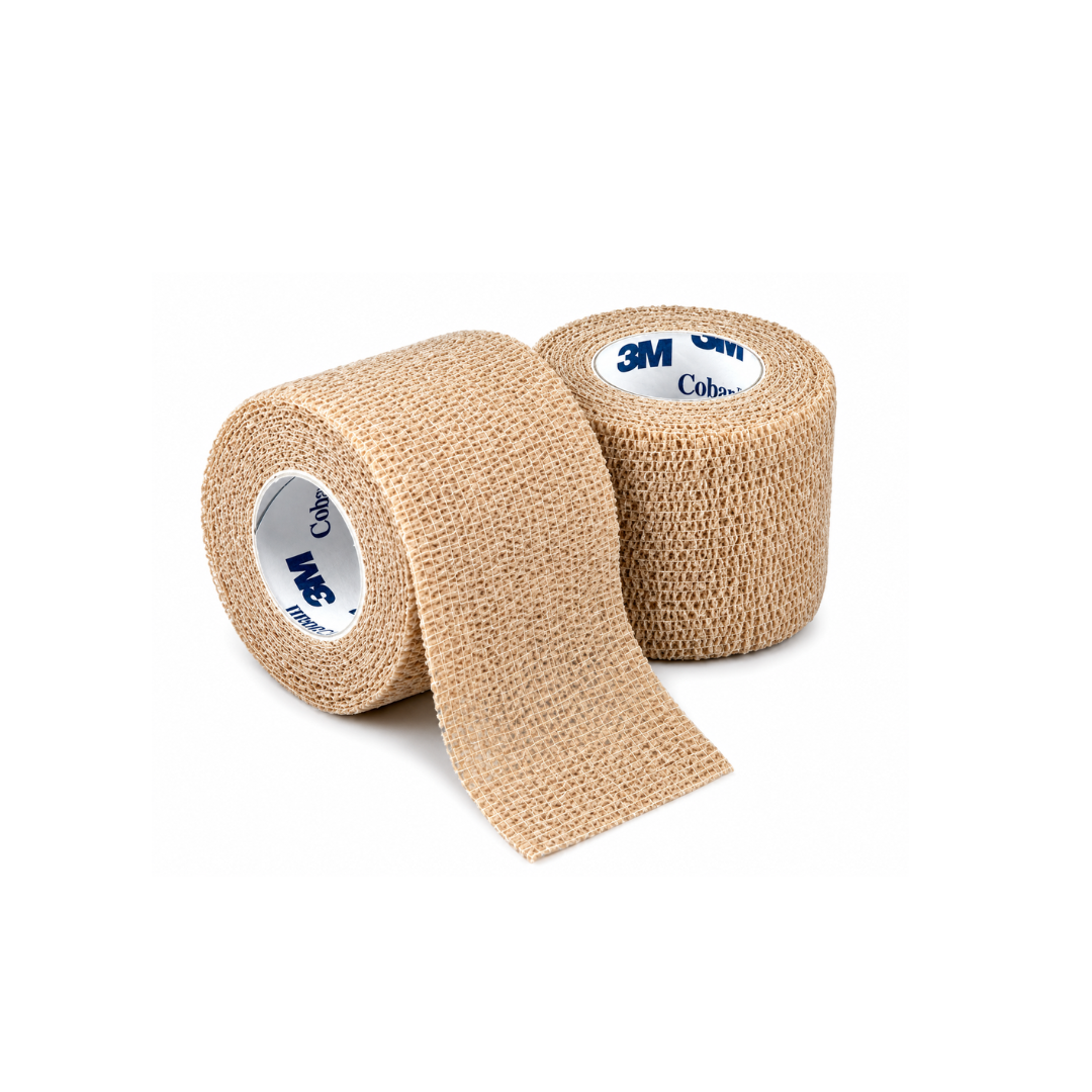 Two rolls of 3M Coban Wrap Elastic Bandage in beige, one partly unrolled. These self-adherent wraps have a textured surface and white inner cores labeled with 3M Coban, providing reliable compression support.