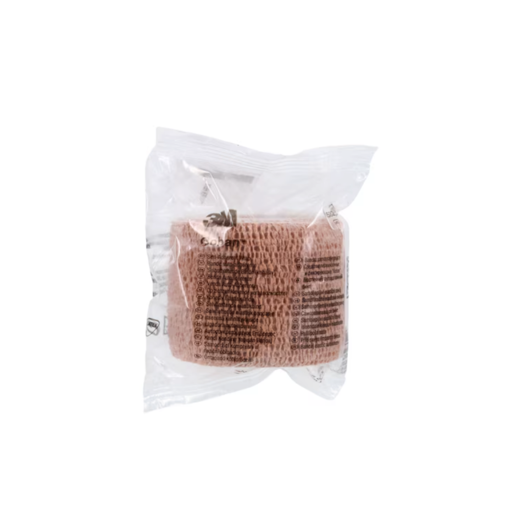 A roll of 3M Coban Wrap Elastic Bandage in tan, wrapped in clear plastic with black text, is displayed against a plain white background.