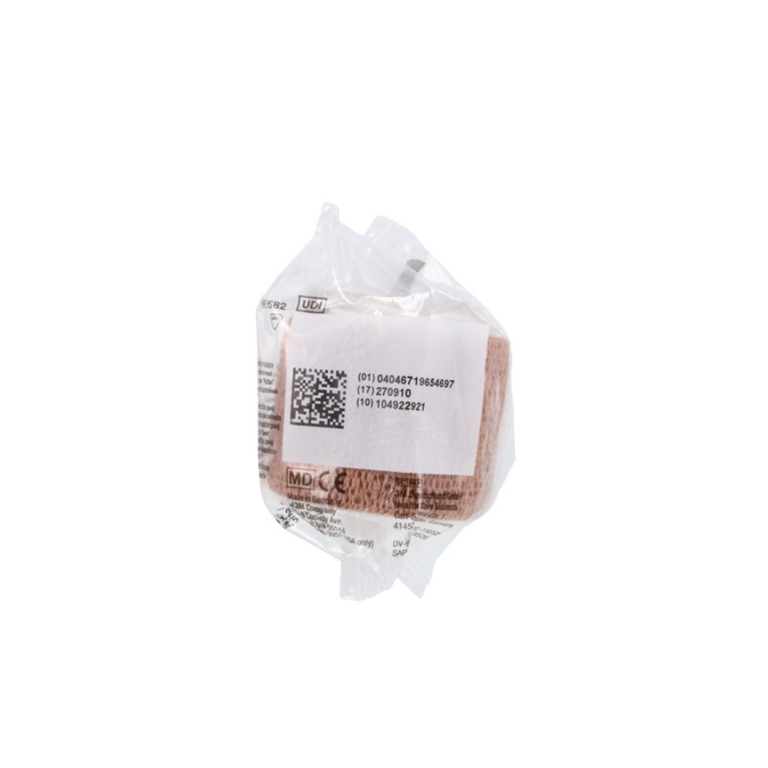 A brown 3M Coban Wrap Elastic Bandage rolled up and sealed in a clear plastic wrapper with a white label showing a barcode, QR code, and product information for compression support.