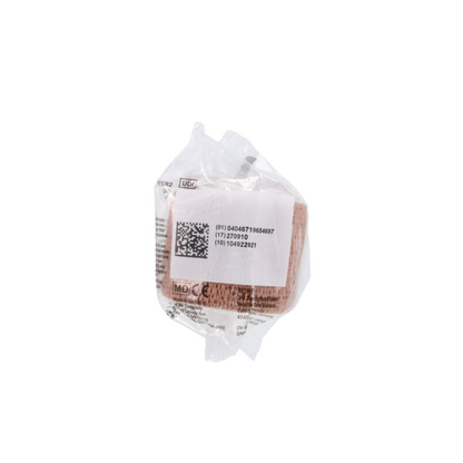 A brown 3M Coban Wrap Elastic Bandage rolled up and sealed in a clear plastic wrapper with a white label showing a barcode, QR code, and product information for compression support.