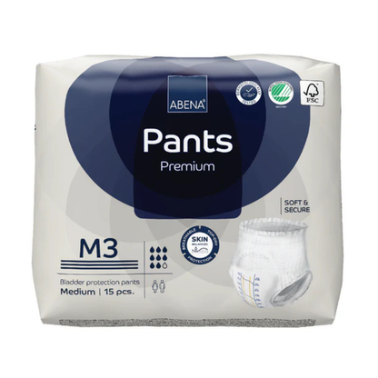 A package of Abena Pants Premium Protective Adult Underwear, medium size, includes 15 pull-up pieces in mainly white packaging with blue accents and clear product information for incontinence needs.